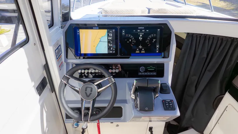 Slide: The Image of The 2026 Navan C30 cockpit features a modern steering wheel and digital displays. - 23