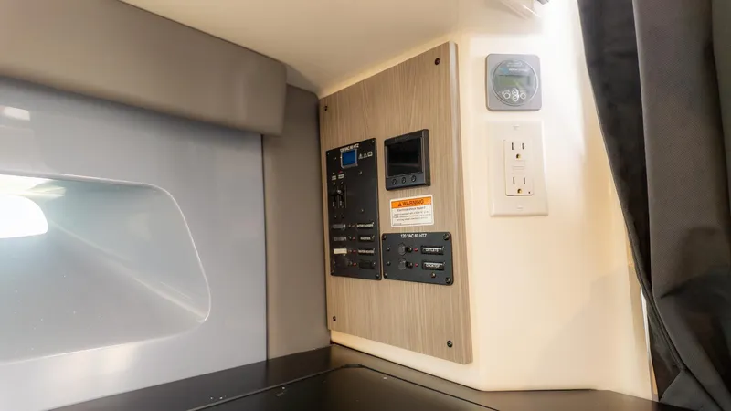 Slide: The Image of Interior view of a boat with control panel and power outlet. - 29