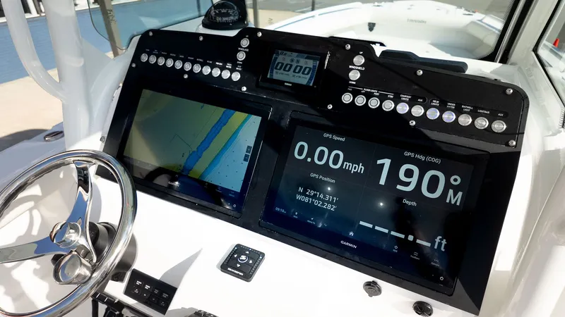 Slide: The Image of Dashboard of an Everglades 273 Center Console boat with modern navigation systems. - 17
