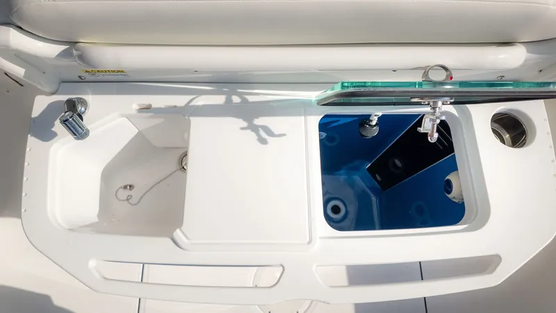 Slide: The Image of The image shows the cockpit of a 2027 Everglades 273 Center Console boat. - 13