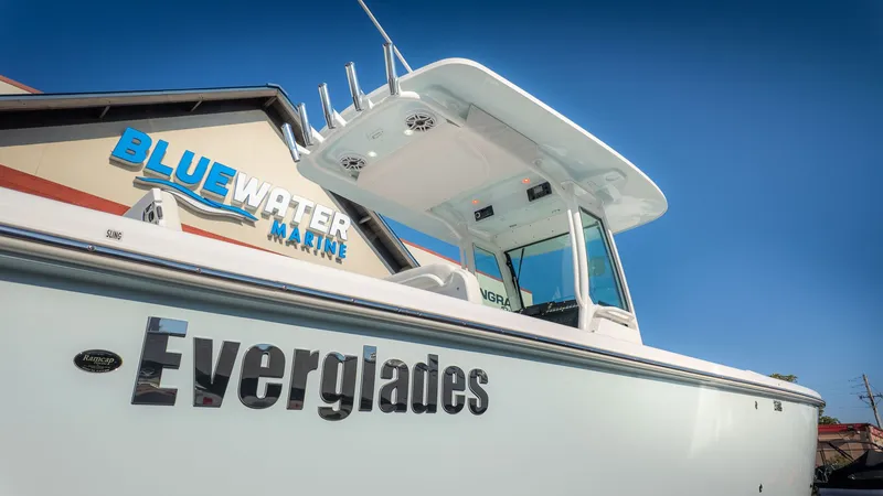 Slide: The Image of Everglades 273 Center Console from 2027 in front of a building with BlueWater Marine sign. - 30
