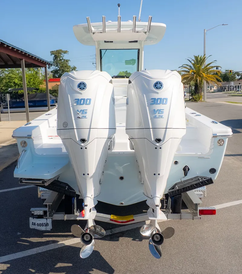 Slide: The Image of The image shows an Everglades 273 Center Console boat with two outboard engines. - 4