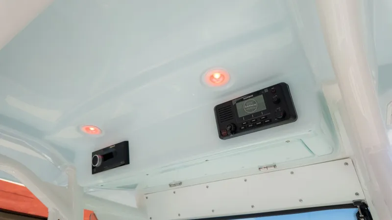 Slide: The Image of Interior view of an Everglades 273 Center Console boat with electronics and lighting. - 15