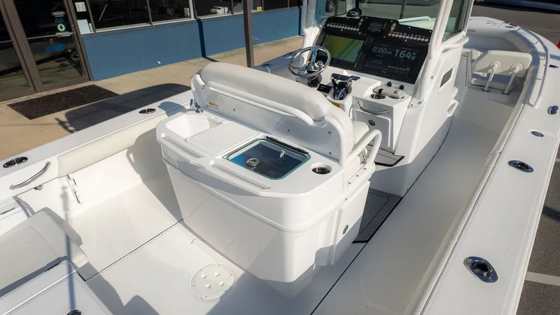 Slide: The Image of The image shows the cockpit of a 2027 Everglades 273 Center Console boat. - 8