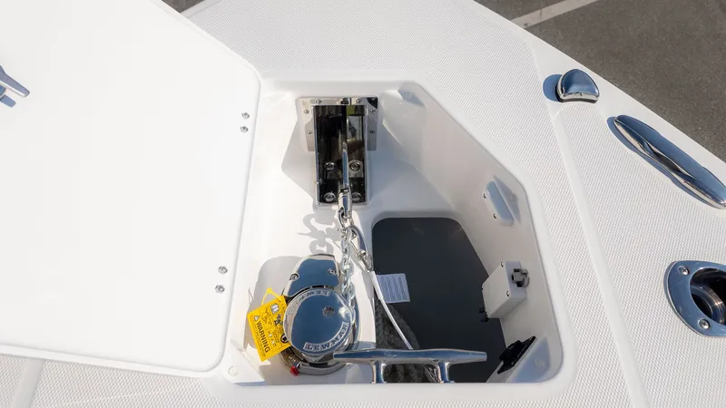Slide: The Image of Anchor locker of an Everglades 273 Center Console boat with chain and windlass. - 23