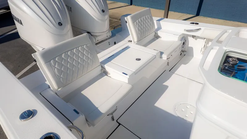 Slide: The Image of The 2027 Everglades 273 Center Console features a spacious white seating area with elegant upholstery. - 4