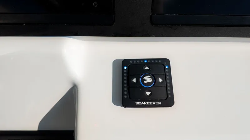 Slide: The Image of Close-up of a Seakeeper control panel on an Everglades 273 Center Console boat. - 18