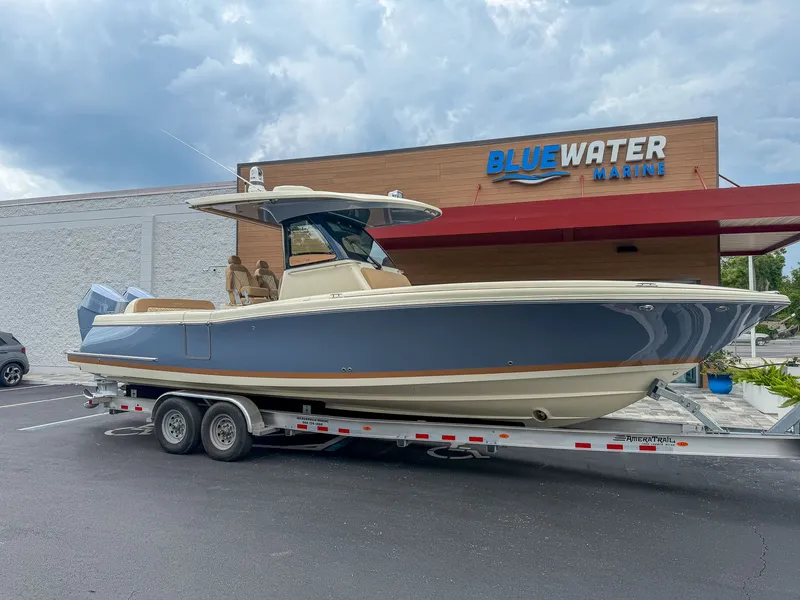 Slide: The Image of Chris-Craft Catalina 30 Heritage Edition on a trailer in front of a building. - 18