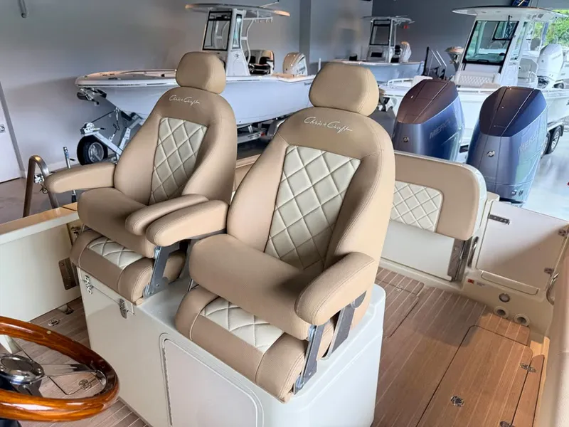 Slide: The Image of Two luxurious, padded seats with a quilted design on a Chris-Craft Catalina 30 boat. - 3