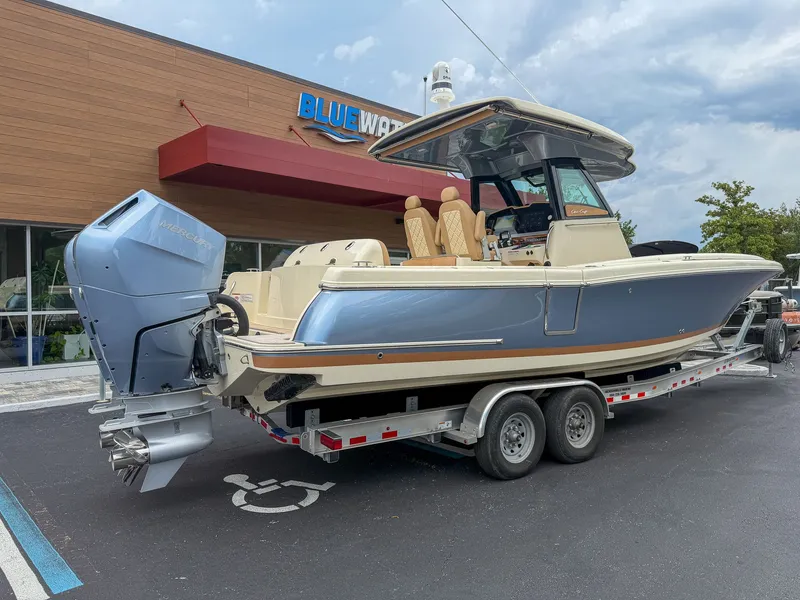 Slide: The Image of Chris-Craft Catalina 30 Heritage Edition 2024 on a trailer in front of a building. - 19