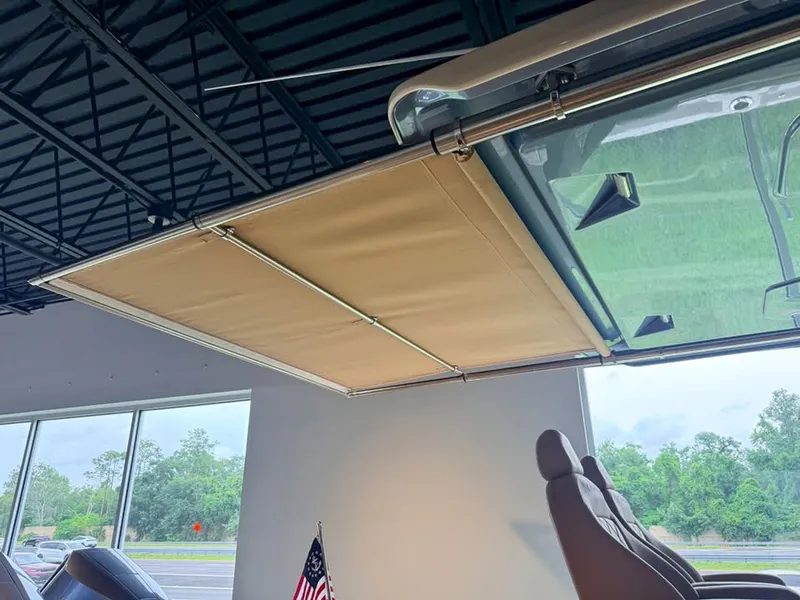 Slide: The Image of Interior view of a boat with a retractable sunshade and an American flag motif. - 11