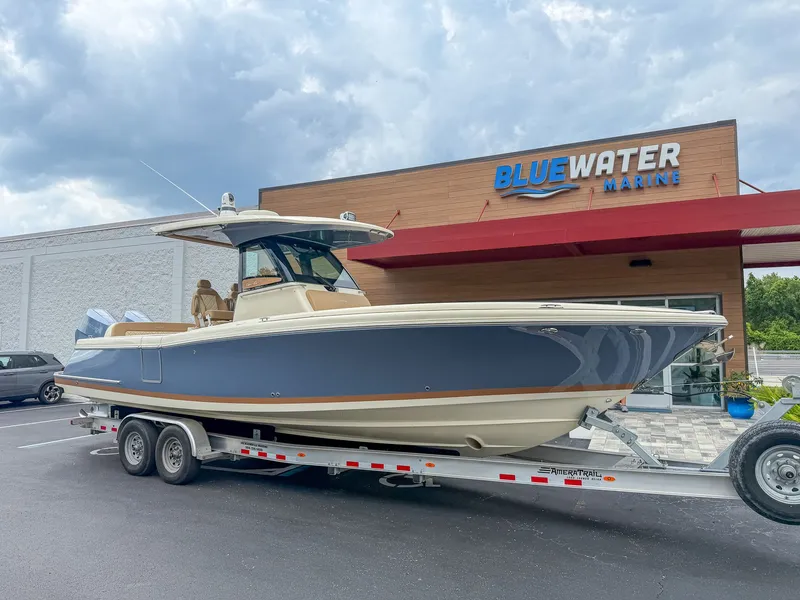 Slide: The Image of 2024 Chris-Craft Catalina 30 Heritage Edition on a trailer in front of a building. - 16