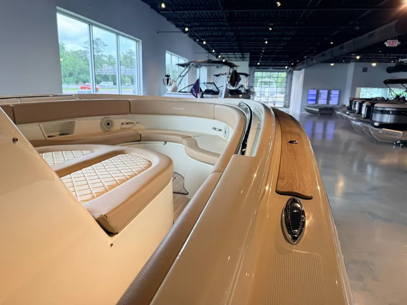Slide: The Image of Interior view of a Chris-Craft Catalina 30 Heritage Edition with elegant seating and wood accents. - 8