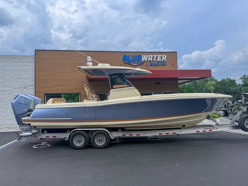 Slide: The Image of 2024 Chris-Craft Catalina 30 Heritage Edition on a trailer in front of a building. - 12