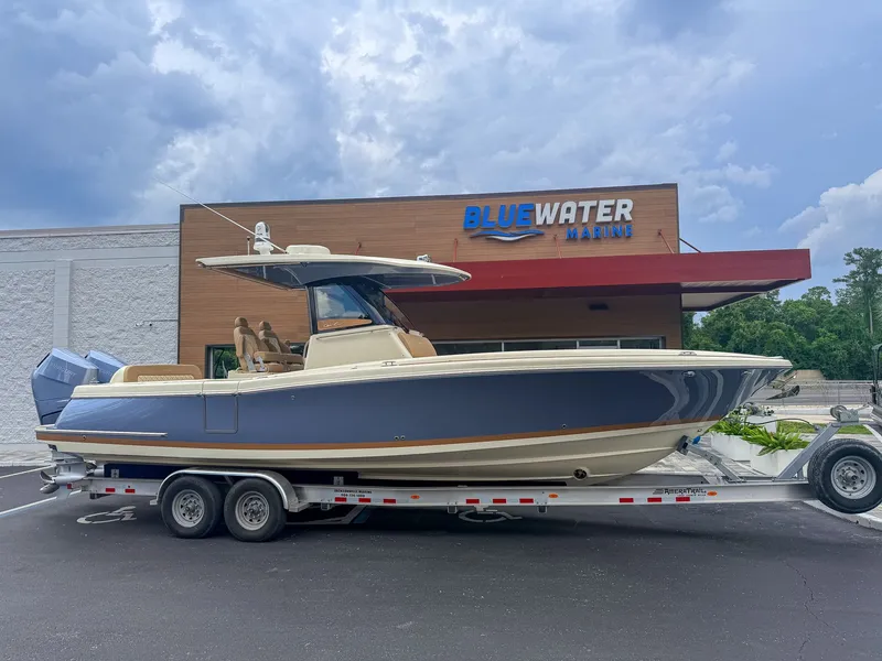 Slide: The Image of 2024 Chris-Craft Catalina 30 Heritage Edition on a trailer in front of a building. - 11