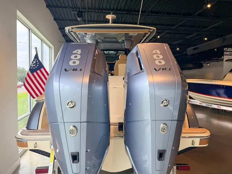 Slide: The Image of Two powerful outboard engines on a Chris-Craft Catalina 30 Heritage Edition boat in a showroom. - 4