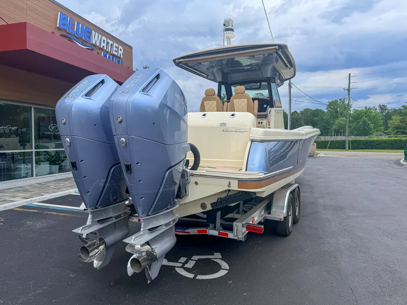 The Image of Chris-Craft Catalina 30 Heritage Edition on a trailer in front of a building. - 1