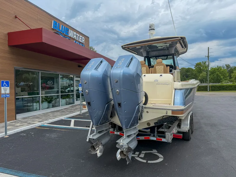 Slide: The Image of Chris-Craft Catalina 30 Heritage Edition 2024 on a trailer outside a building. - 19