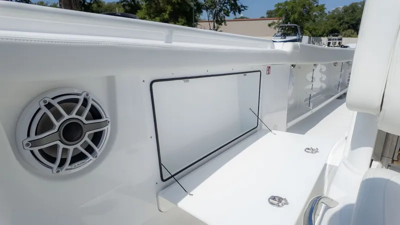 Slide: The Image of Close-up of a white boat deck with speaker and storage compartment. - 17