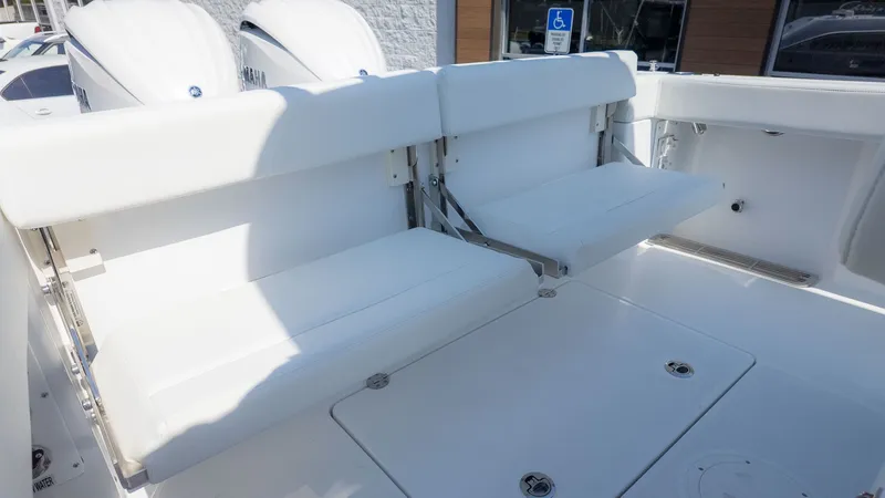 Slide: The Image of The 2026 Everglades 285 Center Console features white, foldable seats in the rear area. - 25