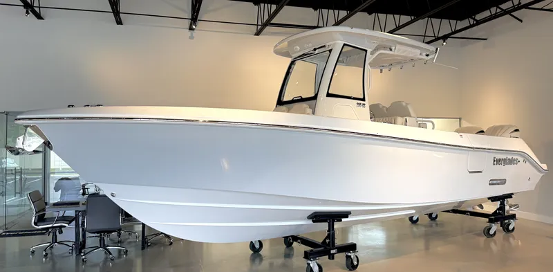 Slide: The Image of A 2026 Everglades 285 Center Console boat is displayed in a modern showroom. - 27