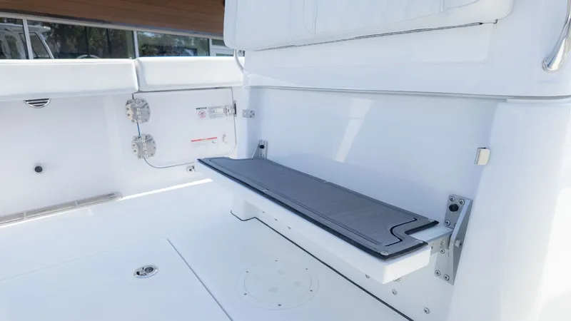 Slide: The Image of The 2026 Everglades 285 Center Console features a clean, white bench seat in the aft area. - 14
