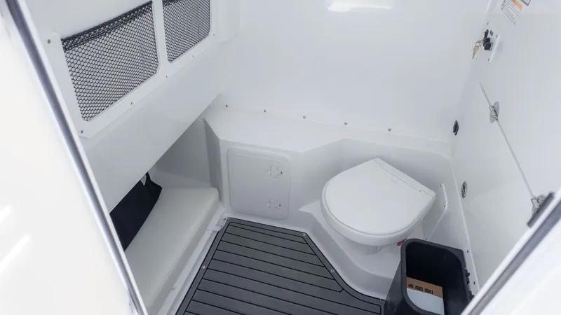 Slide: The Image of Interior of the Everglades 285 Center Console with toilet and storage space. - 4