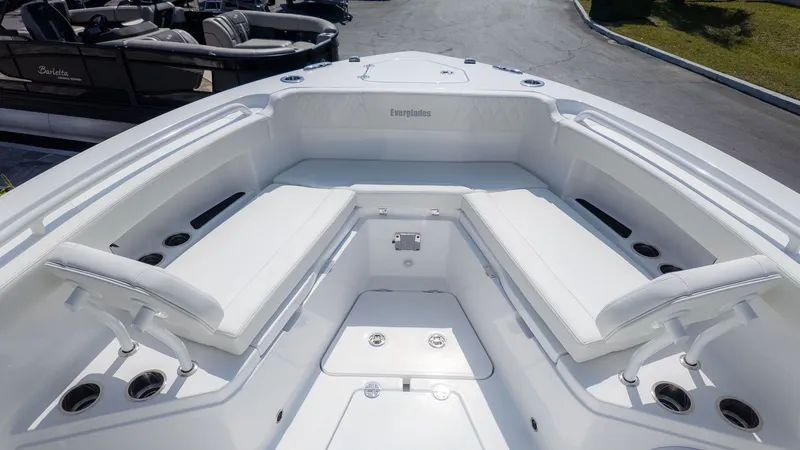 Slide: The Image of The image shows the bow of an Everglades 285 Center Console boat with white seating. - 8