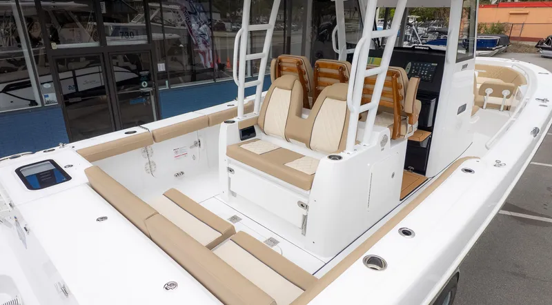 Slide: The Image of The image shows the cockpit of a 2026 Everglades 335 Center Console boat with beige seating. - 6