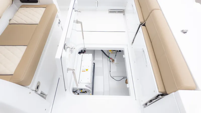 Slide: The Image of The image shows the interior of an Everglades 335 Center Console boat with seating and storage. - 13