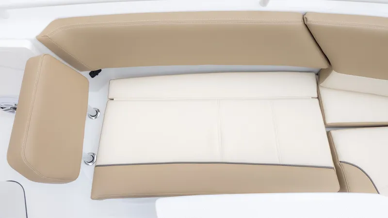 Slide: The Image of Beige and white upholstery on a boat seat, likely in the bow area. - 18