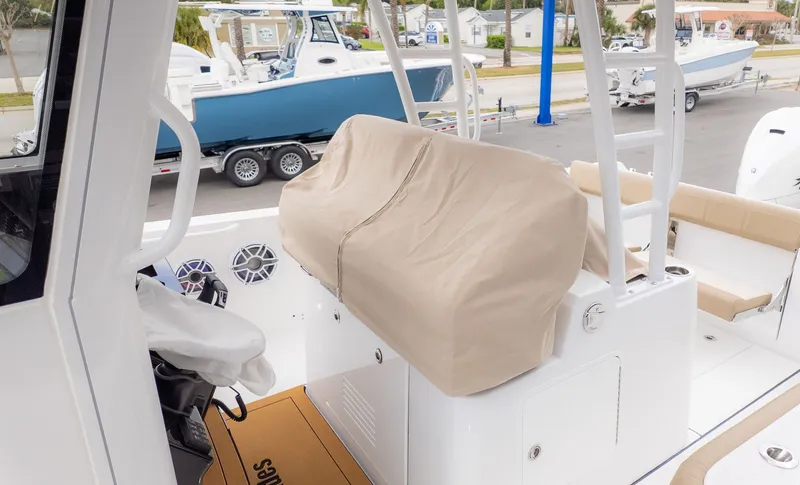 Slide: The Image of An Everglades 335 Center Console boat with a covered seating area and helm station. - 30