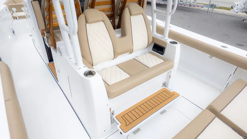 Slide: The Image of The 2026 Everglades 335 Center Console features a sleek, modern interior with beige seating. - 9