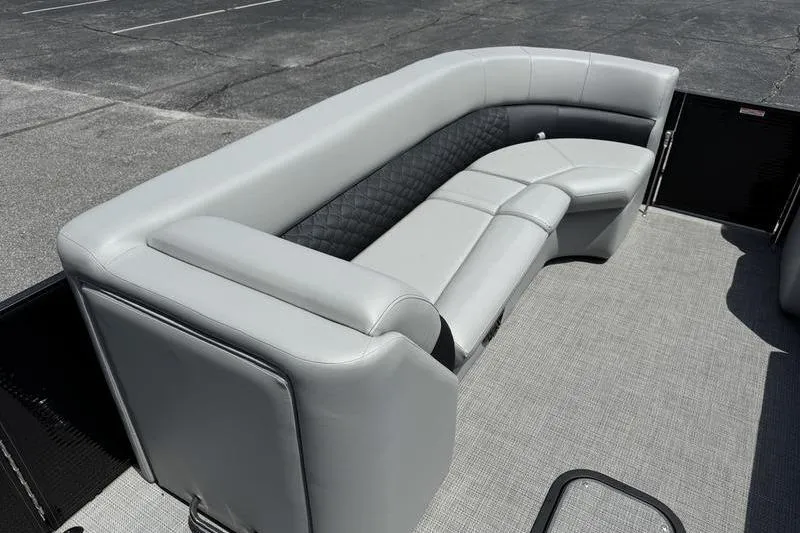 Slide: The Image of Luxurious seating on 2026 Manitou Encore 25 SL SHP pontoon boat, featuring sleek gray upholstery. - 9