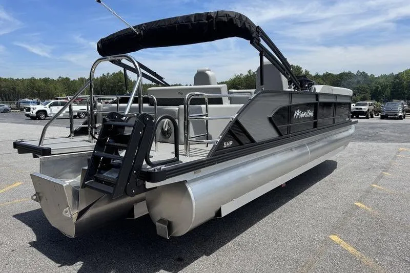Slide: The Image of 2026 Manitou Encore 25 SL SHP pontoon boat in parking lot, rear view. - 3