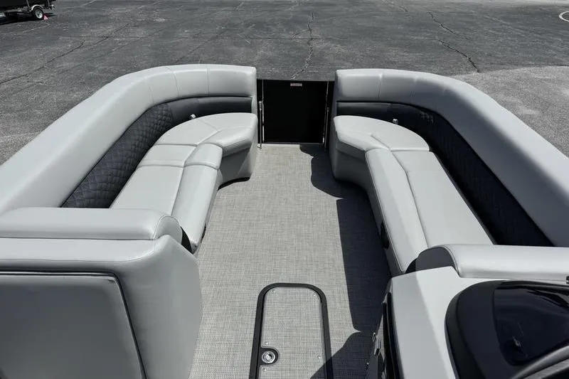 Slide: The Image of 2026 Manitou Encore 25 SL SHP pontoon boat with spacious seating and modern design. - 15