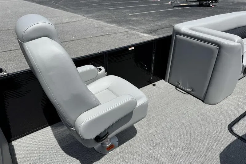 Slide: The Image of Gray seating on 2026 Manitou Encore 25 SL SHP pontoon boat, featuring modern design. - 17
