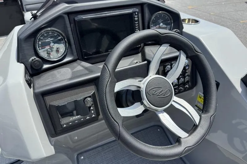 Slide: The Image of Steering console of 2026 Manitou Encore 25 SL SHP with modern gauges and controls. - 13