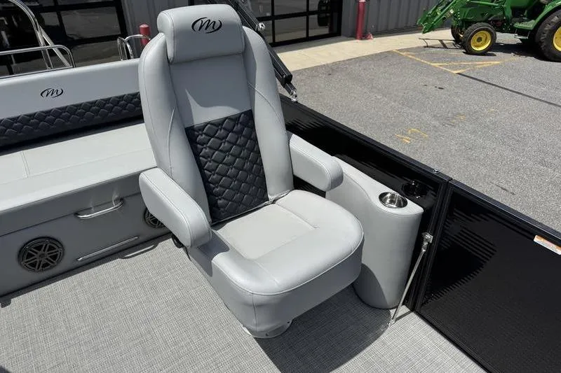 Slide: The Image of Luxurious seating on 2026 Manitou Encore 25 SL SHP pontoon boat, featuring sleek design and comfort. - 16