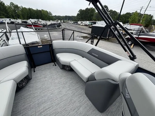 Slide: The Image of The image shows the interior of a Viaggio Lago V22U boat with gray seating. - 17