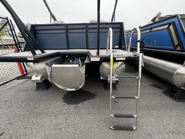 Slide: The Image of The image shows the rear of a Viaggio Lago V22U pontoon boat with a ladder. - 44