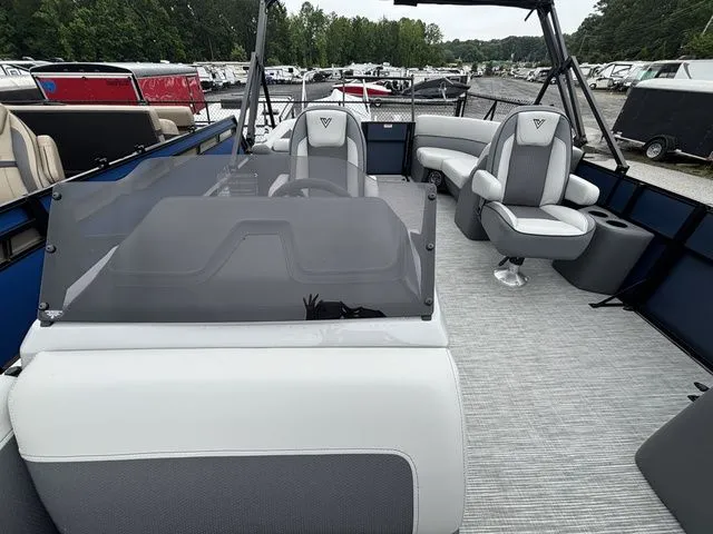 Slide: The Image of The image shows a modern pontoon boat with gray seating and a helm station. - 39