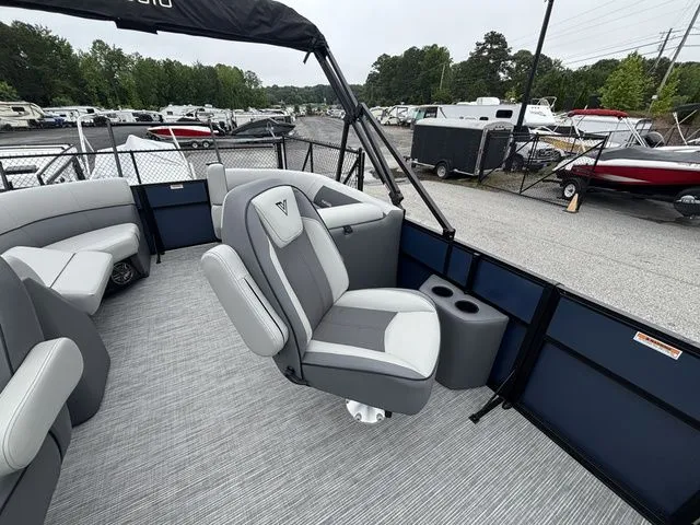 Slide: The Image of The image shows the interior of a Viaggio Lago V22U boat with gray seating and a helm. - 13