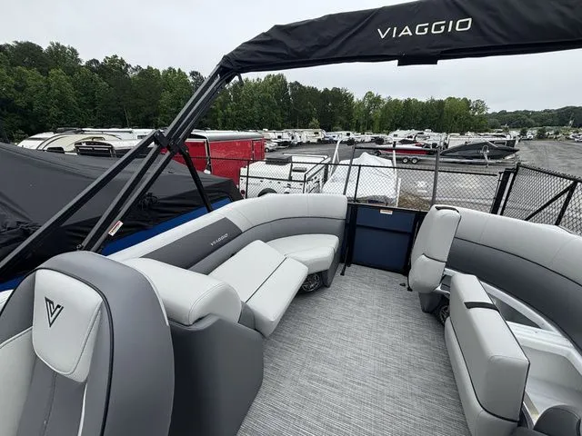 Slide: The Image of Viaggio Lago V22U with gray seating and black canopy, parked in a lot. - 15