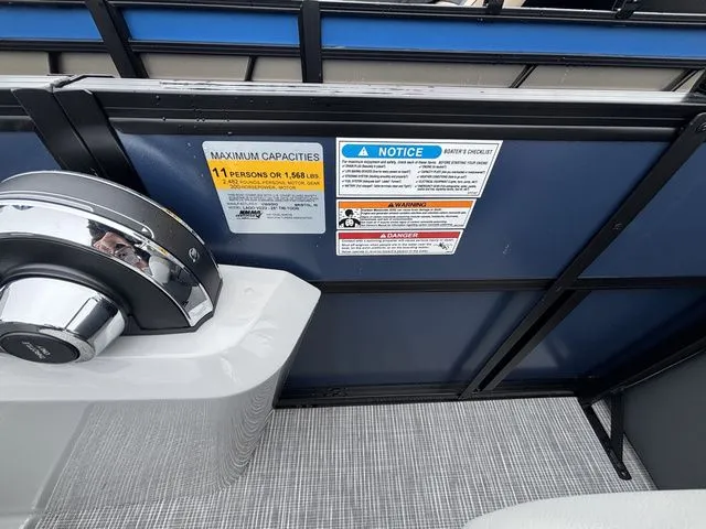 Slide: The Image of Close-up of the control area on a Viaggio Lago V22U with capacity notices. - 28