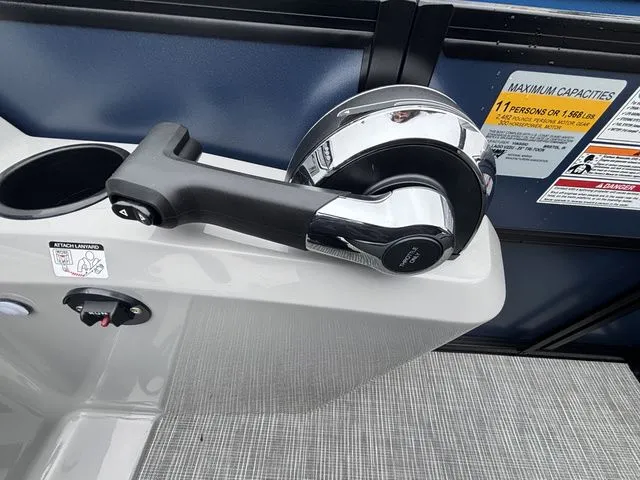 Slide: The Image of Close-up of a boat throttle lever on gray flooring. - 35