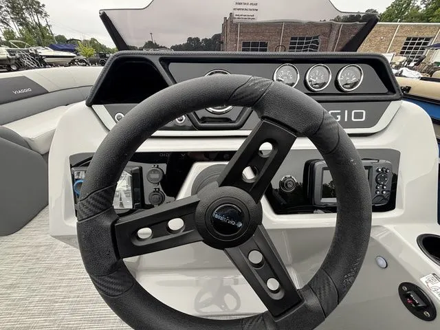 Slide: The Image of The image shows the helm of a Viaggio Lago V22U with a modern dashboard and instruments. - 34