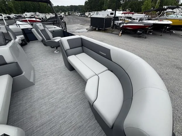 Slide: The Image of The image shows the interior of a Viaggio Lago V22U boat with gray upholstery and spacious seating. - 9