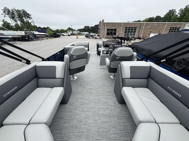 Slide: The Image of The image shows the interior of a Viaggio Lago V22U boat with gray seating. - 20