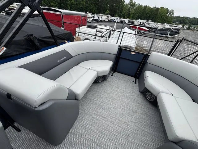 Slide: The Image of The image shows the interior of a Viaggio Lago V22U boat with gray upholstery and an open deck. - 16